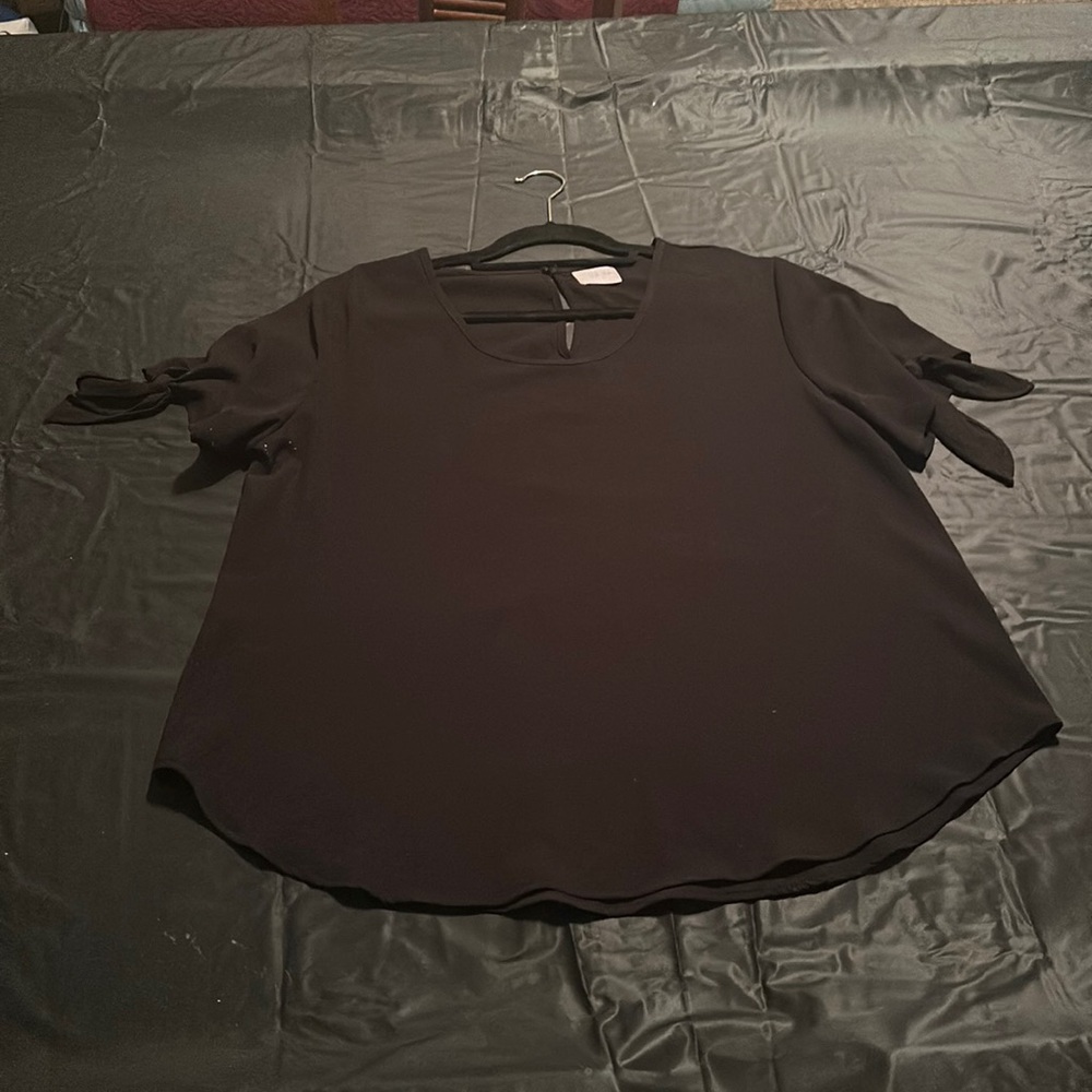 black dressy shirt.  sleeves both tie.
